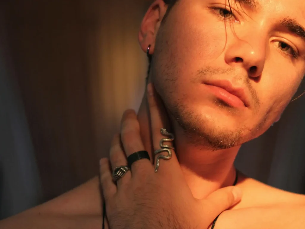 Man touching his neck and posing after getting liposuction