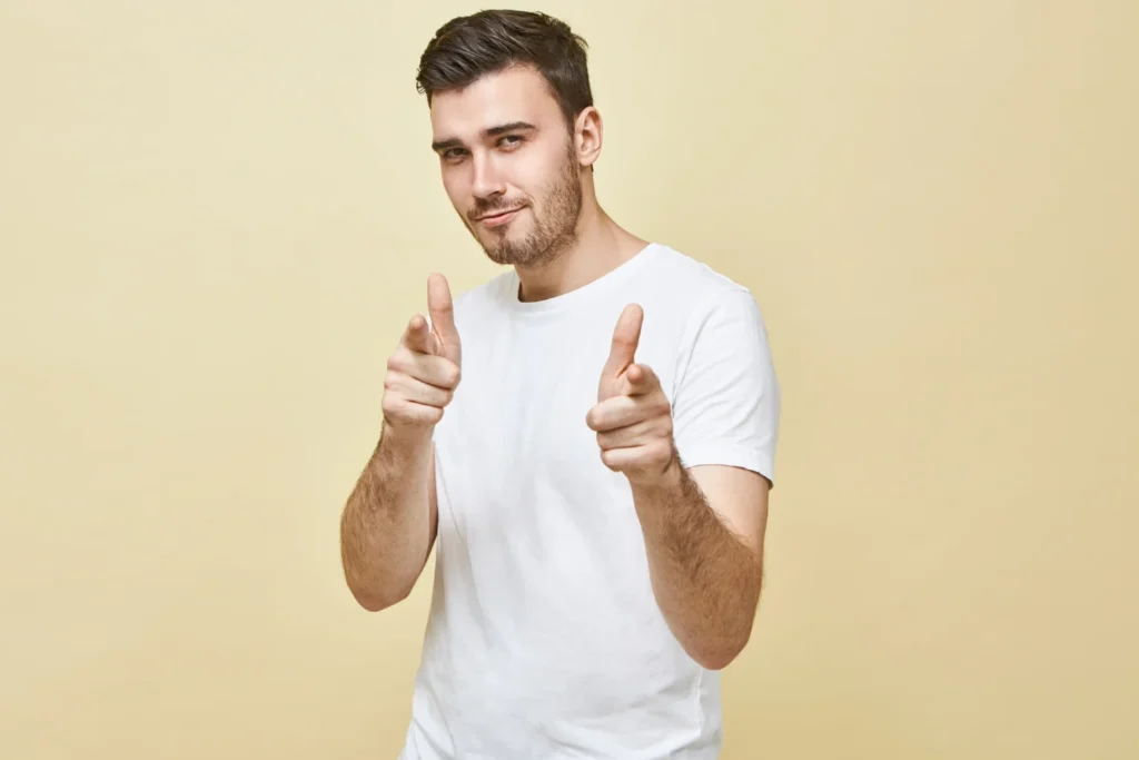 Man looking happy and pointing his fingers to encourage people about neck lipo