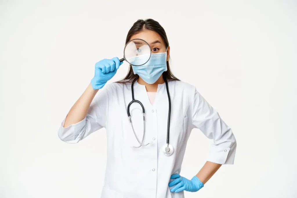Plastic surgeon holding magnifying glass and looking for liraglutide therapy candidates