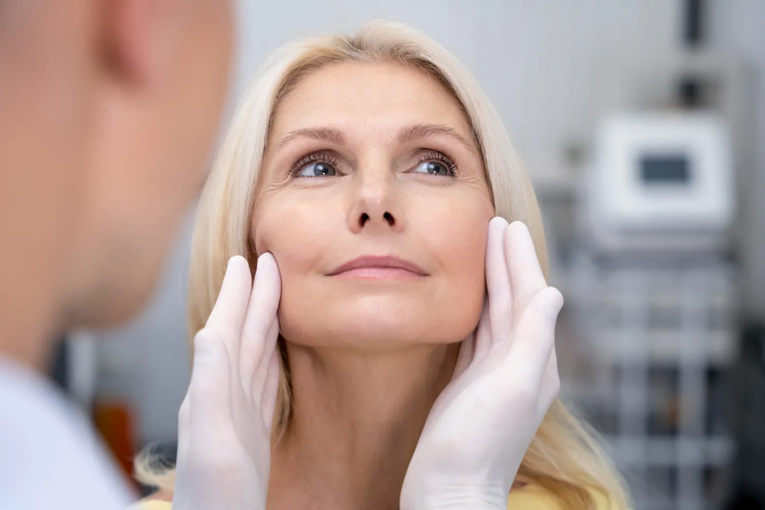Close-up doctor checking smiling woman