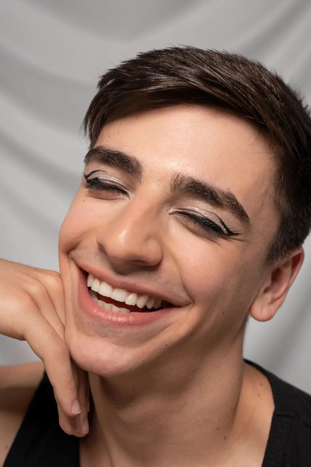 Close up portrait of person wearing make up eye liner