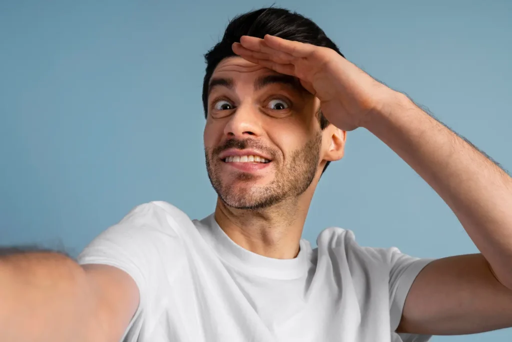 Front view of man taking a selfie