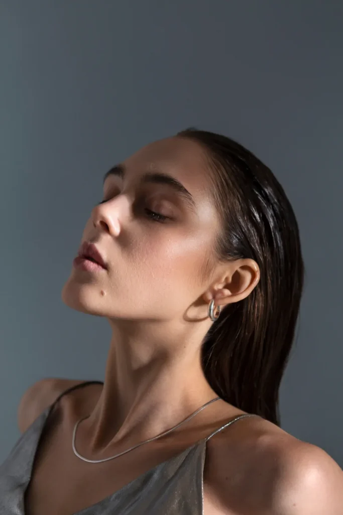Pisces portrait of beautiful woman showing of chin and jawline