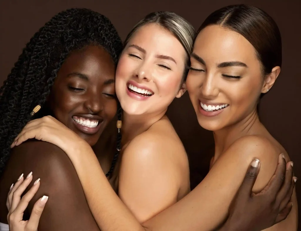 Three diverse women posing very beautifully after plastic surgery