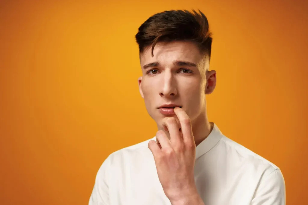 Young man with defined jawline considering PDO thread lift treatment