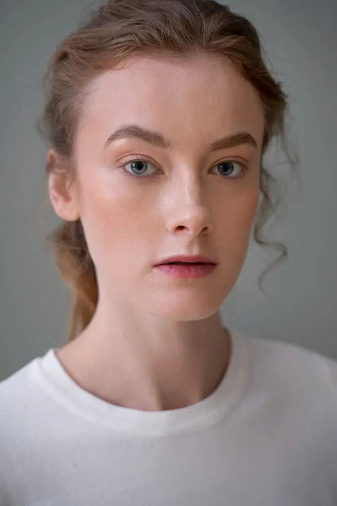 beautiful woman face wearing minimalist shirt