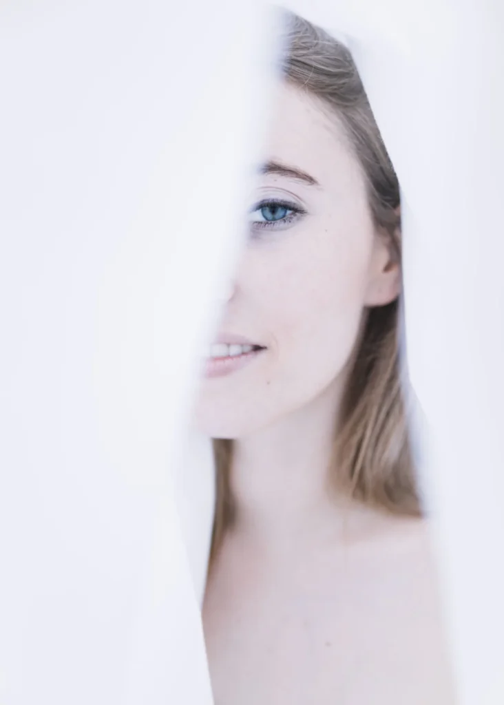 beautiful woman's face white cloth