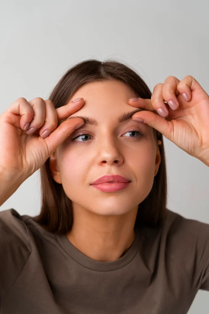 portrait woman trying facial yoga massage stay young