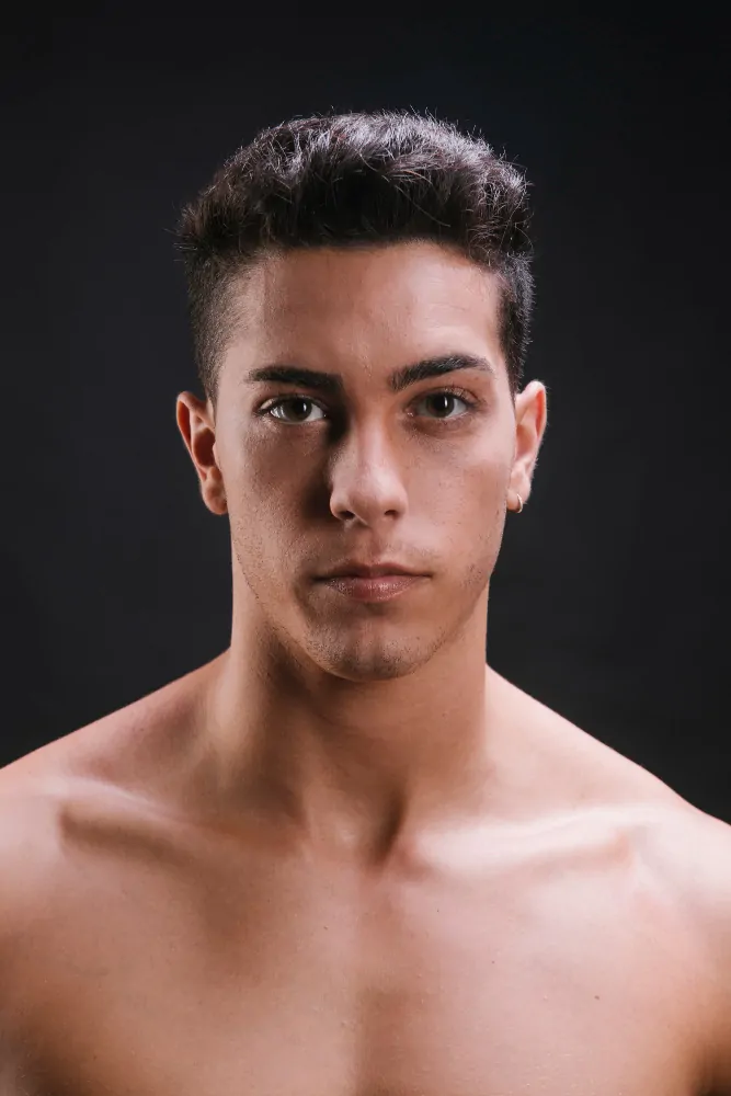 shirtless man looking at camera after facetite treatment