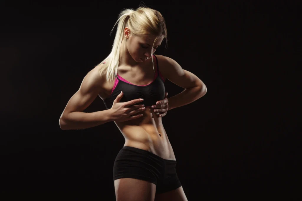woman watching her abs after liposuction