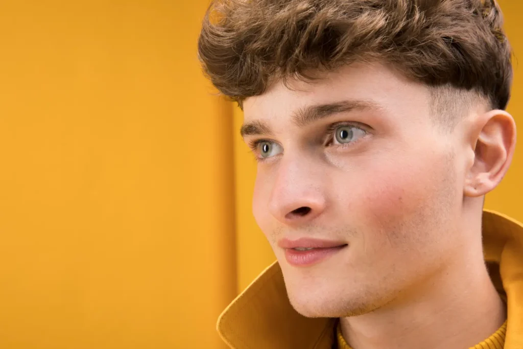 Close-up shot of a man's face after recovering from his FaceTite procedure