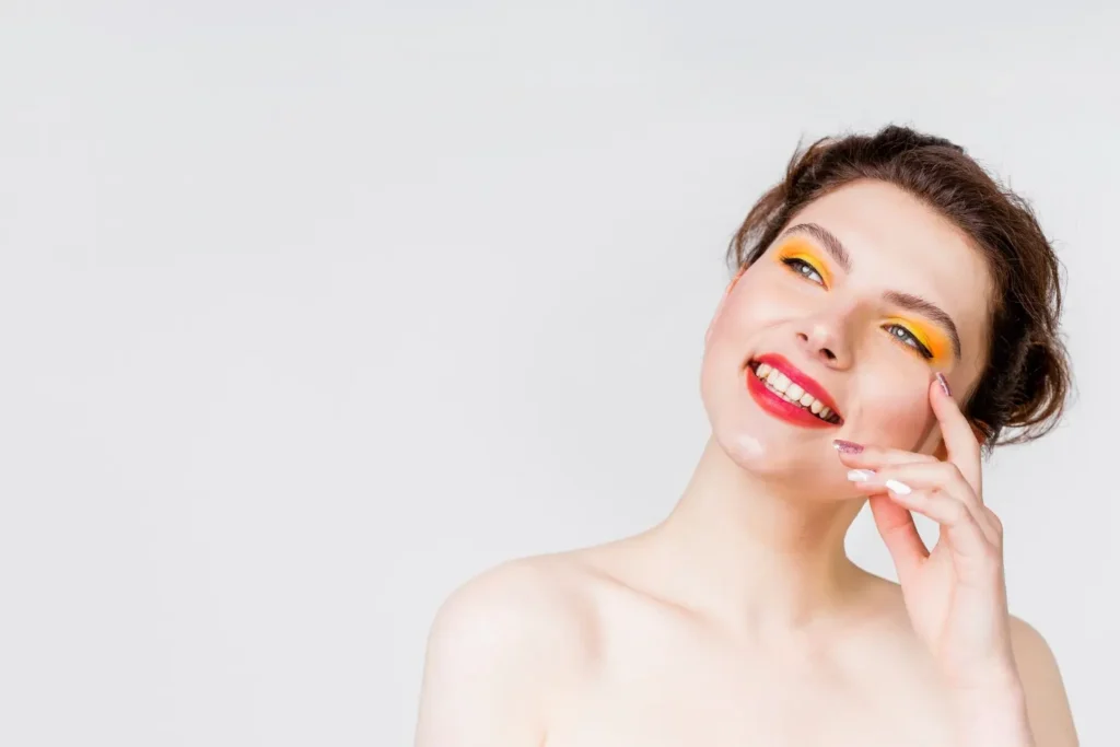 Shirtless woman looking very happy and satisfied after getting neck liposuction