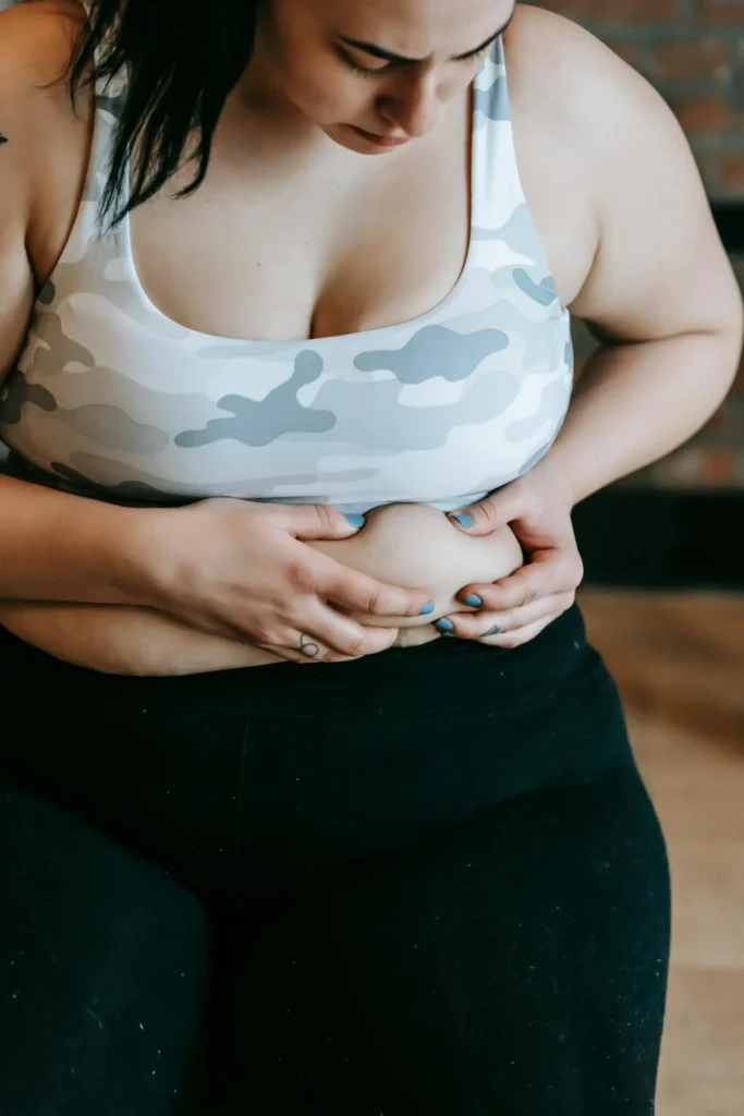 a woman holding her belly