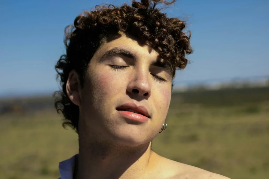Close-up shot of a man under the sun showing his Botox results