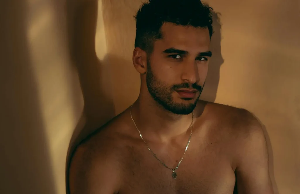 Shirtless man showing off his side profile after getting neck liposuction