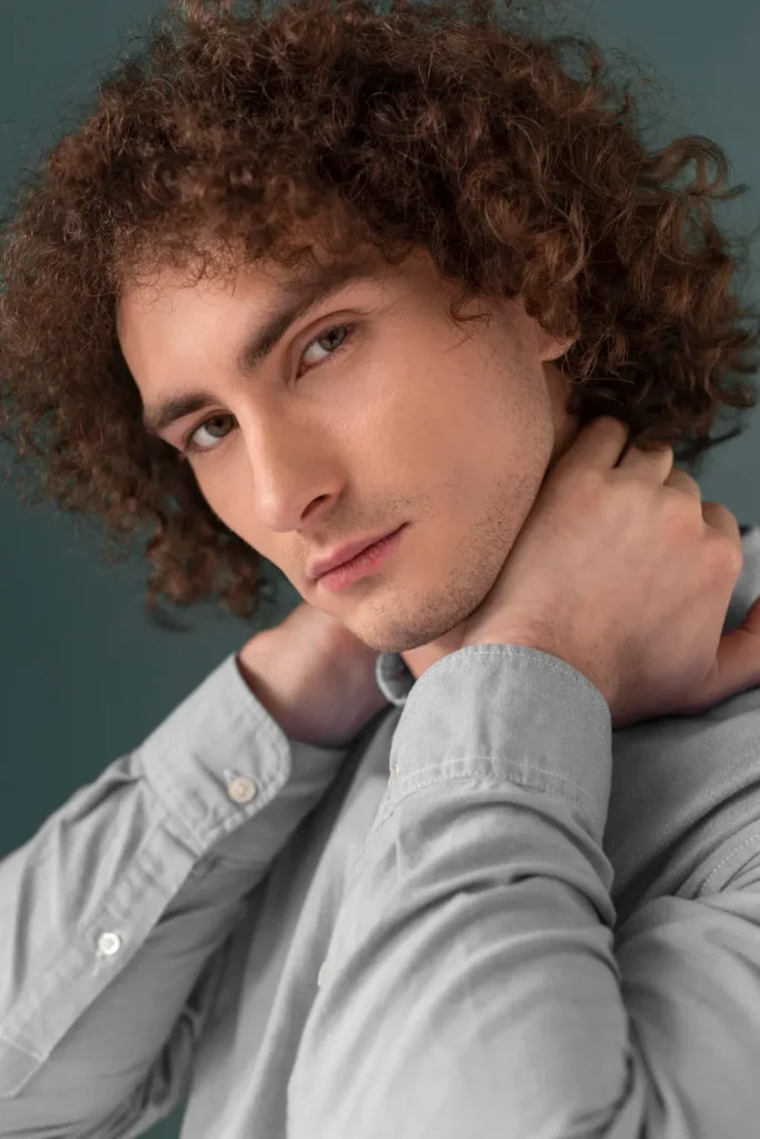 Portrait curly haired young man