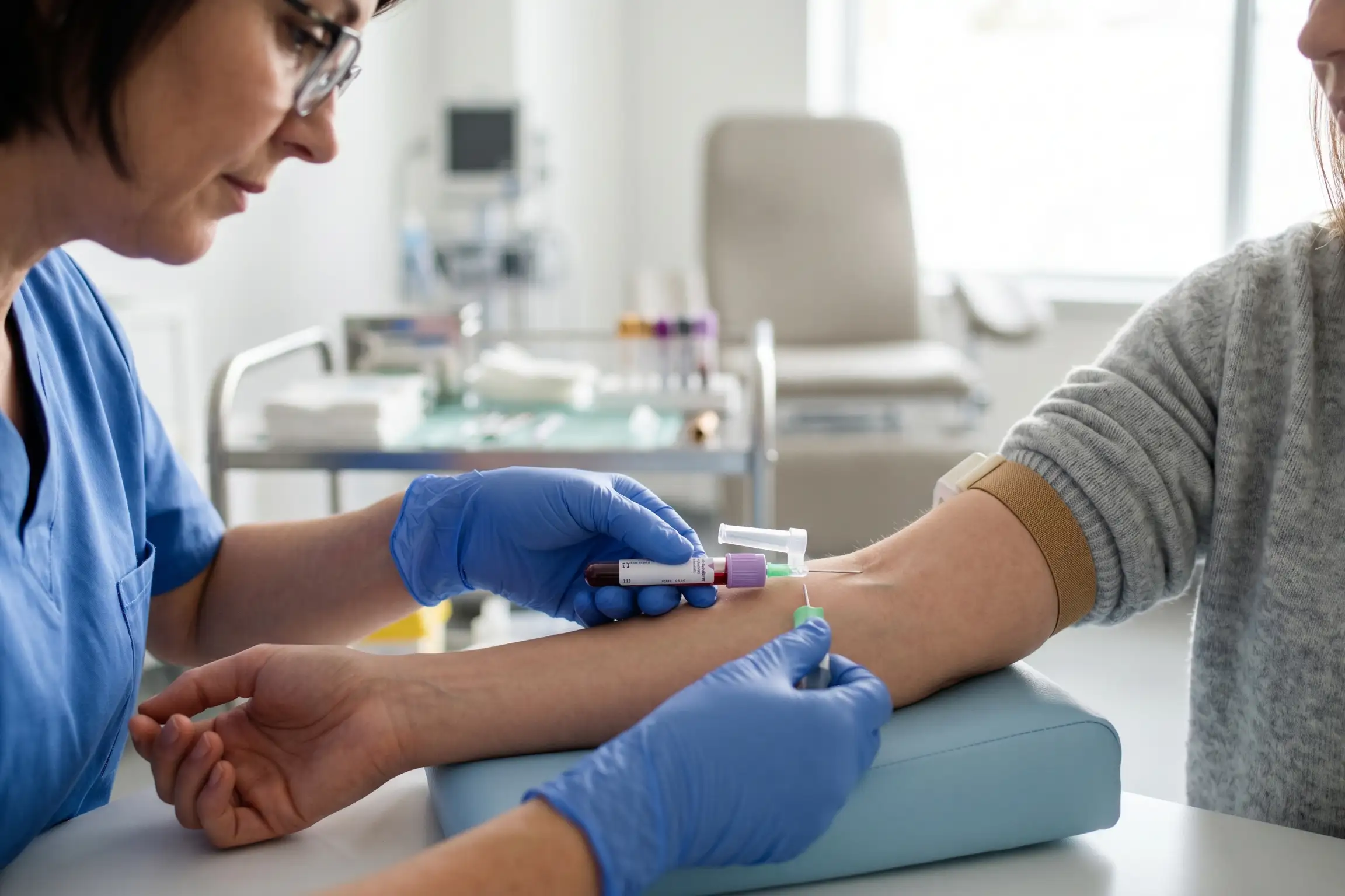 Clinician drawing a blood sample for a PRP facial in a Tampa clinic