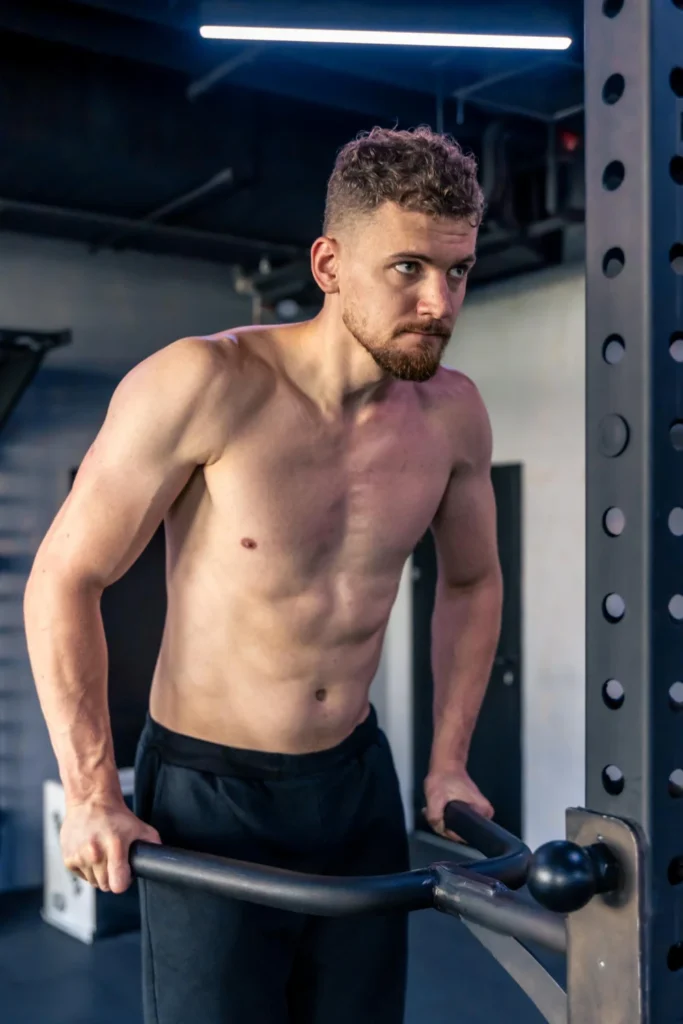 Athlete doing pushups in the gym with a bare torso sport lifestyle