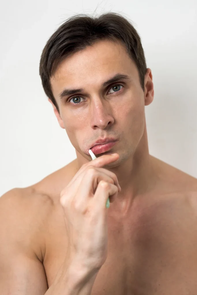 Portrait of a man brushing his teeth