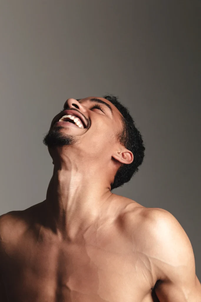 Young laughing african man isolated