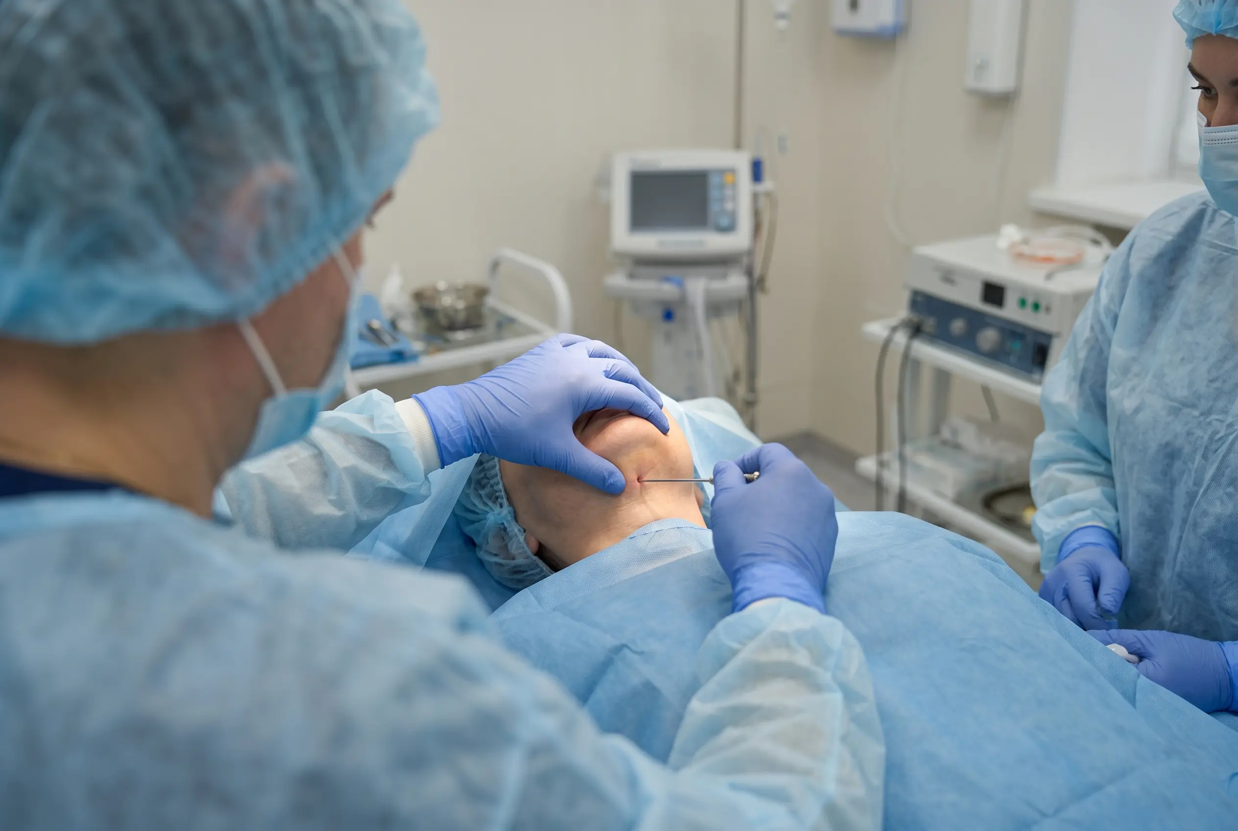 Thin cannula delivering helium plasma energy beneath the chin during a neck procedure