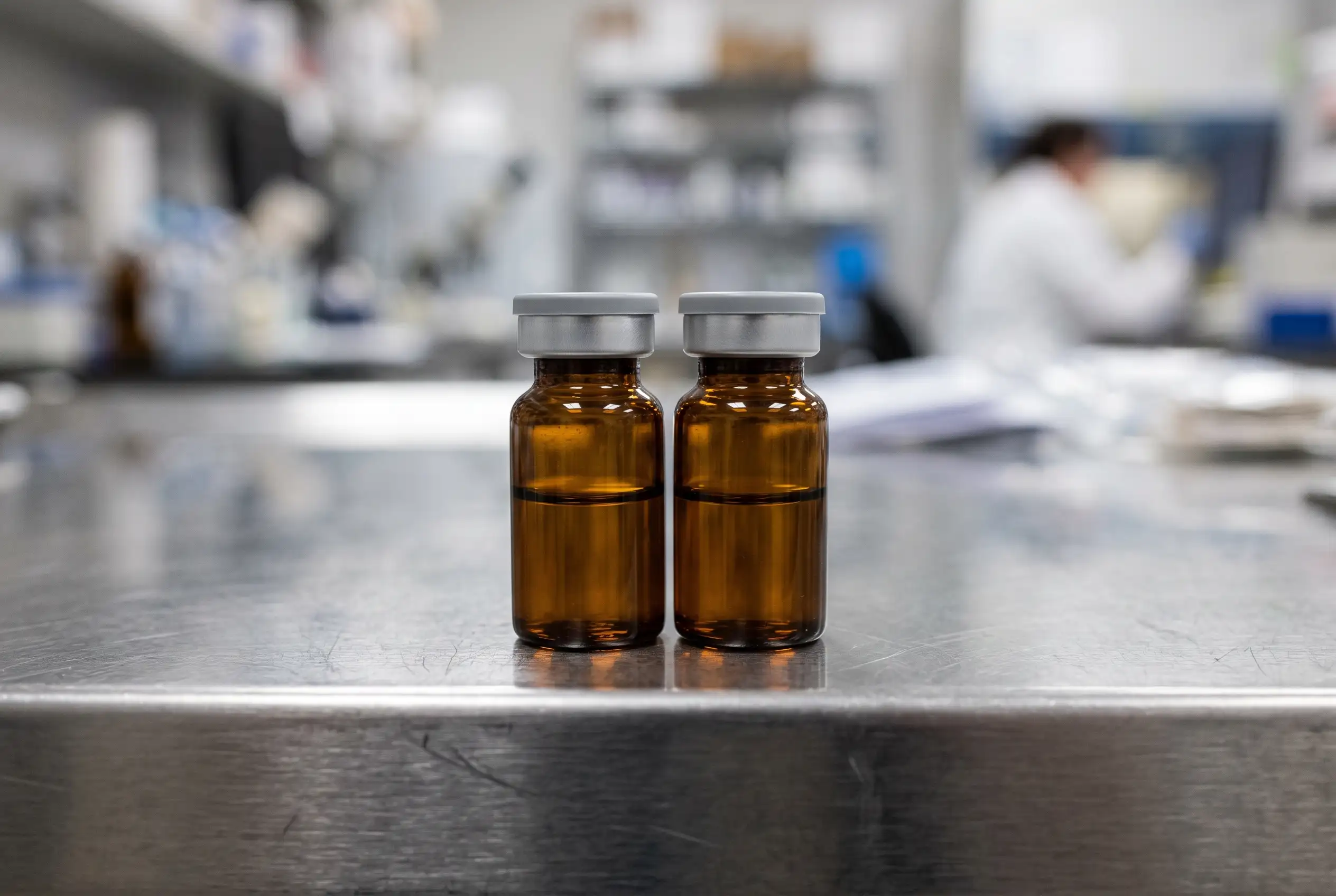 Two unlabeled peptide vials side by side representing the Dihexa or Semax comparison