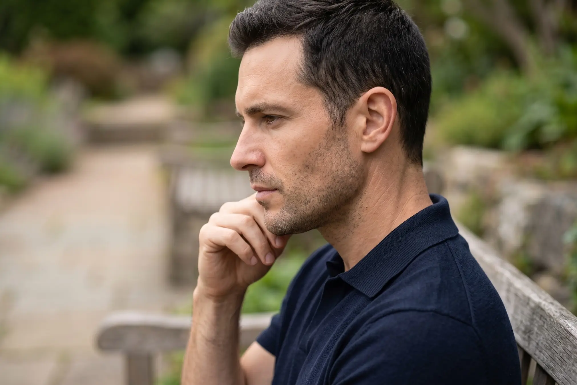 Man in profile considering how to reduce jaw size without surgery in Tampa