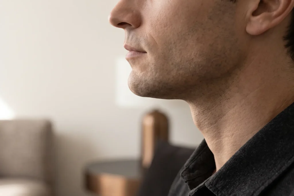 Man with a defined jawline profile after jawline fillers in Lowry Park North, Tampa