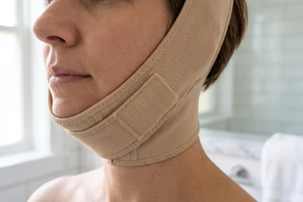 Chin compression garment worn during the first week of Renuvion recovery