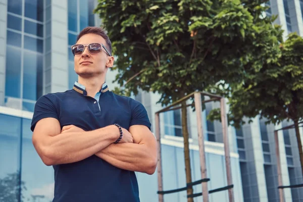 Man in blue shirt looking very fit after hormone therapy