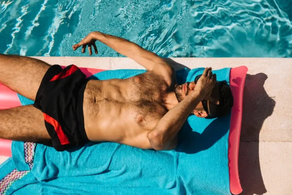 Man in the pool and tanning after Botox