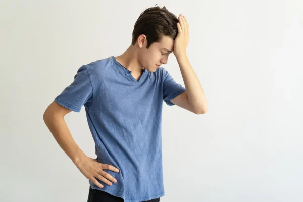 Man looking anxious after experiencing some side effects during Botox recovery