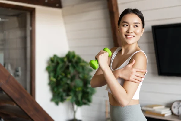 Woman doing light exercises after tummy tuck surgery