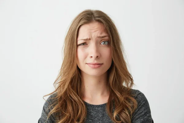 Woman getting insecure with her frown lines before Botox