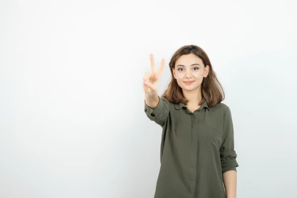 Woman posing with the peace sign after PDO thread lift recovery