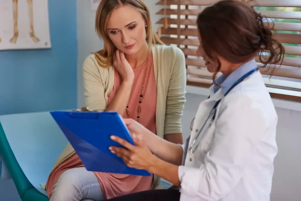 Woman undergoing HD liposuction consultation