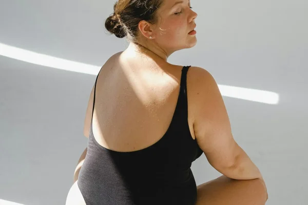 Back view of a woman thinking of getting an abdominoplasty
