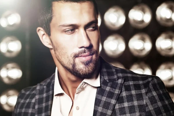Celebrity posing and showing off his chiseled jawline after liposuction