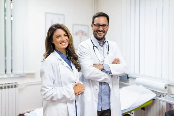 Cosmetic surgeons looking very happy after performing a successful plastic surgery