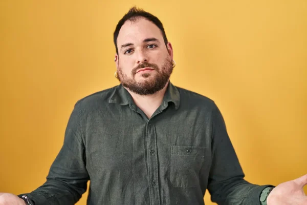 Man deciding if he should go for face lipo or FaceTite