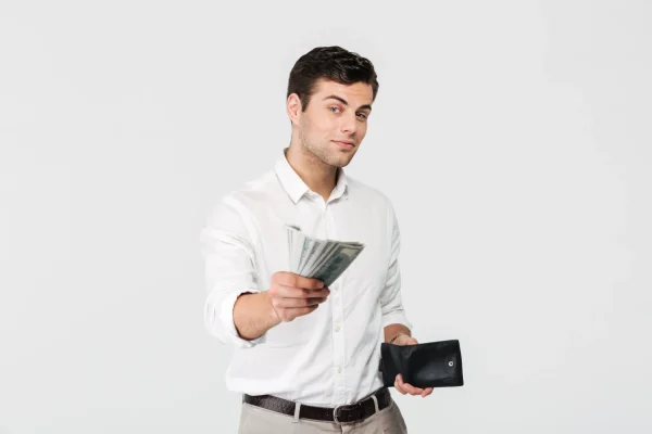 Man in the act of paying money to get non-surgical cosmetic procedures