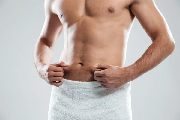 Man looking manly and fit after tummy tuck