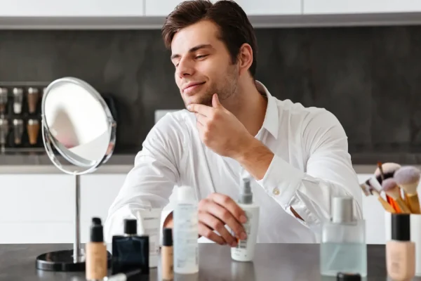 Man prepping his face for makeup after Botox recovery