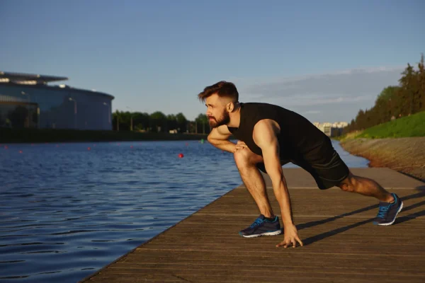 Man stretching and exercising after full recovery from tummy tuck