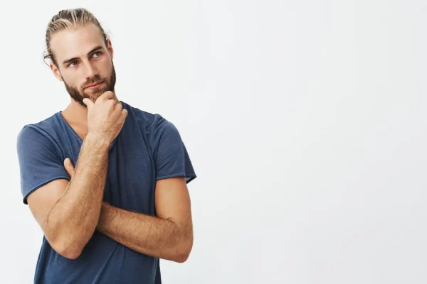 Man thinking about long abdominal hardening lasts after undergoing liposuction