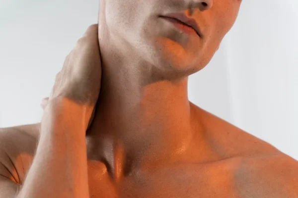 Man touching his nape after neck tightening procedure recovery