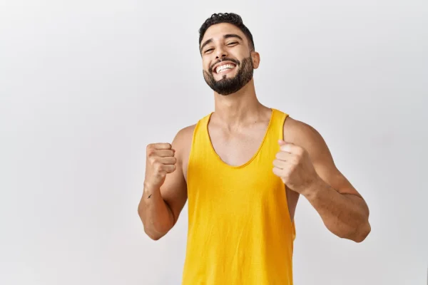Man wearing yellow top and looking healthy after undergoing thymosin alpha 1 and thymosin beta 4 therapy
