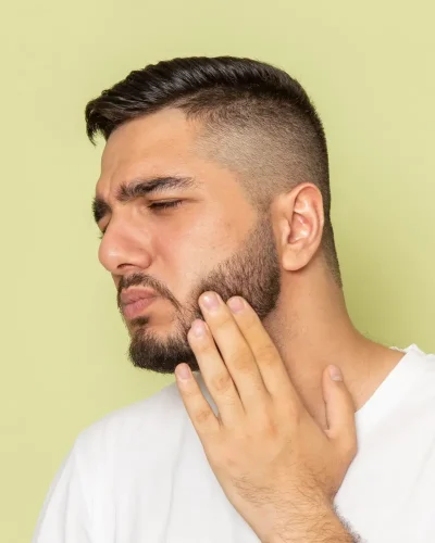 Man wondering if jawline filler injections hurt