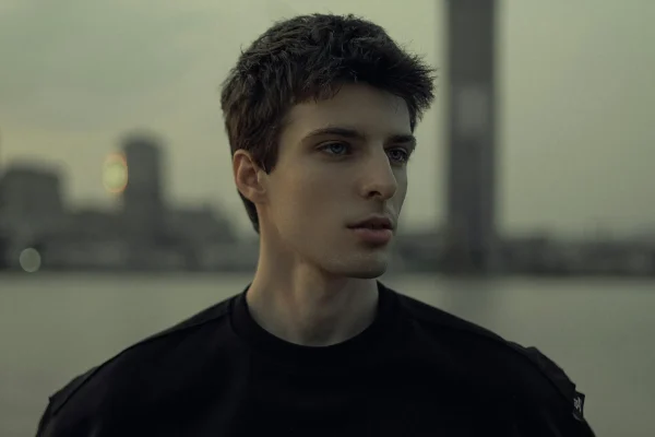 Medium shot of a man's face outside after getting jawline fillers