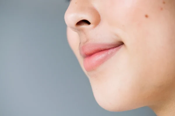 Side profile of a woman after getting a non surgical treatment for her chin